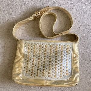 DAWLI gold metallic studded crossbody bag.